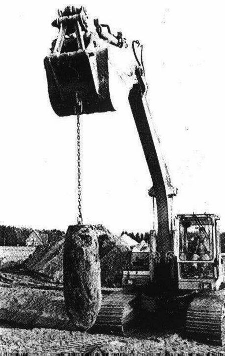 A crane lifts another defused bomb........
